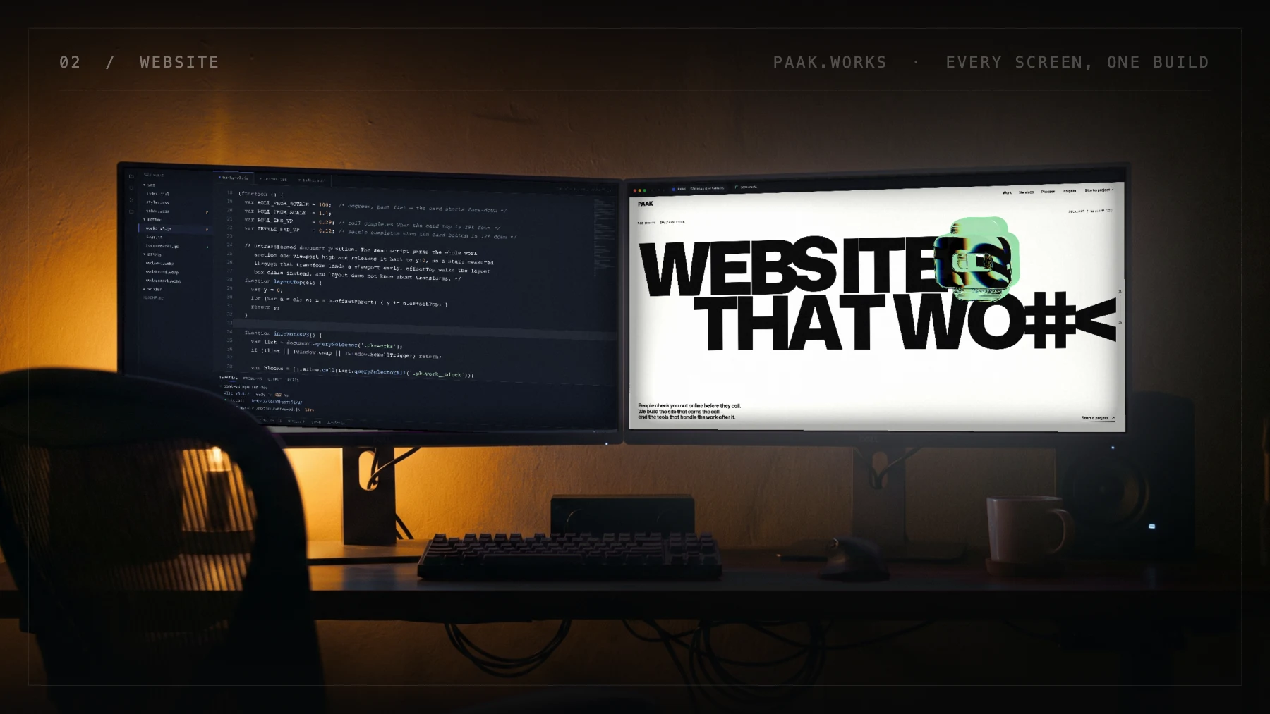 A dark studio desk at night: two wide monitors, one running the build in a code editor, the other showing the finished paak.works site